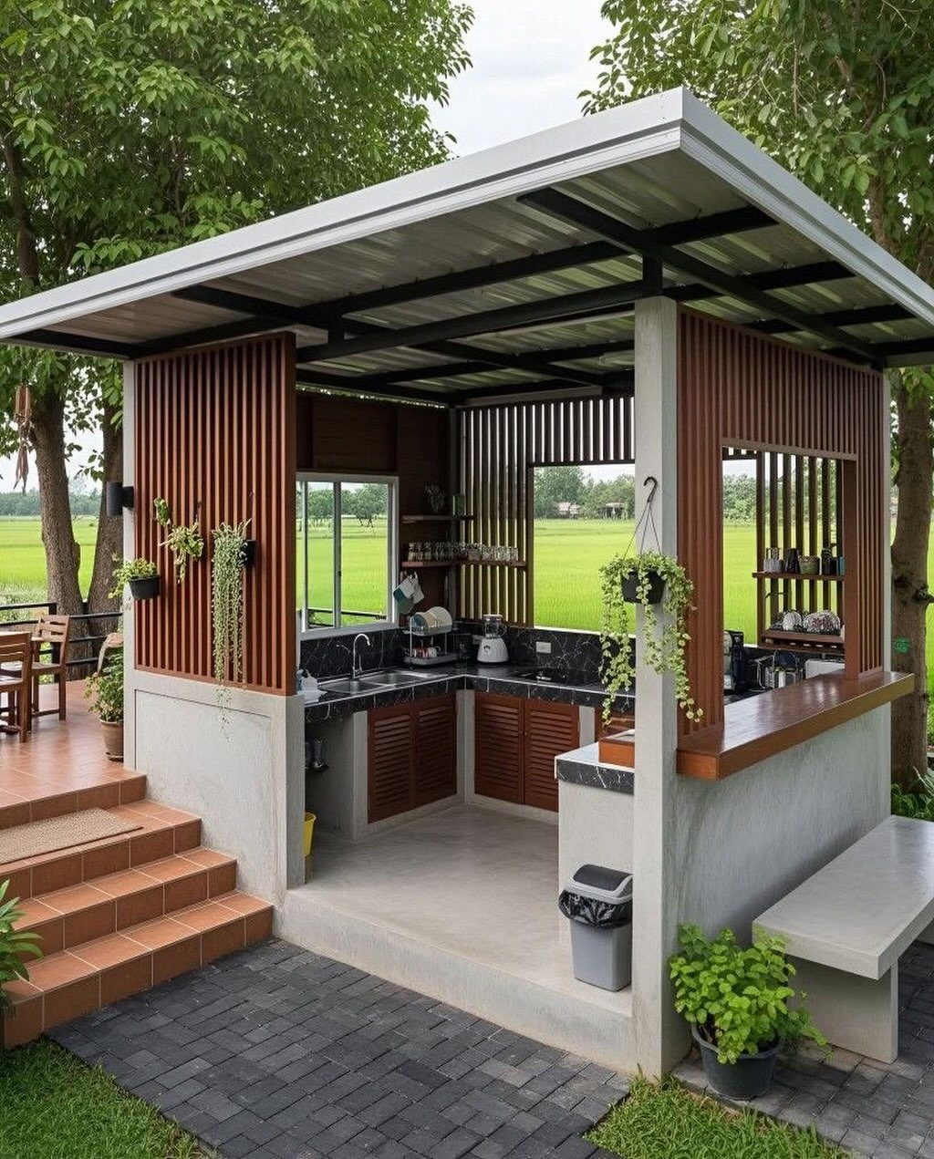 Modern outdoor kitchen with a metal roof, concrete walls, and wooden accents.