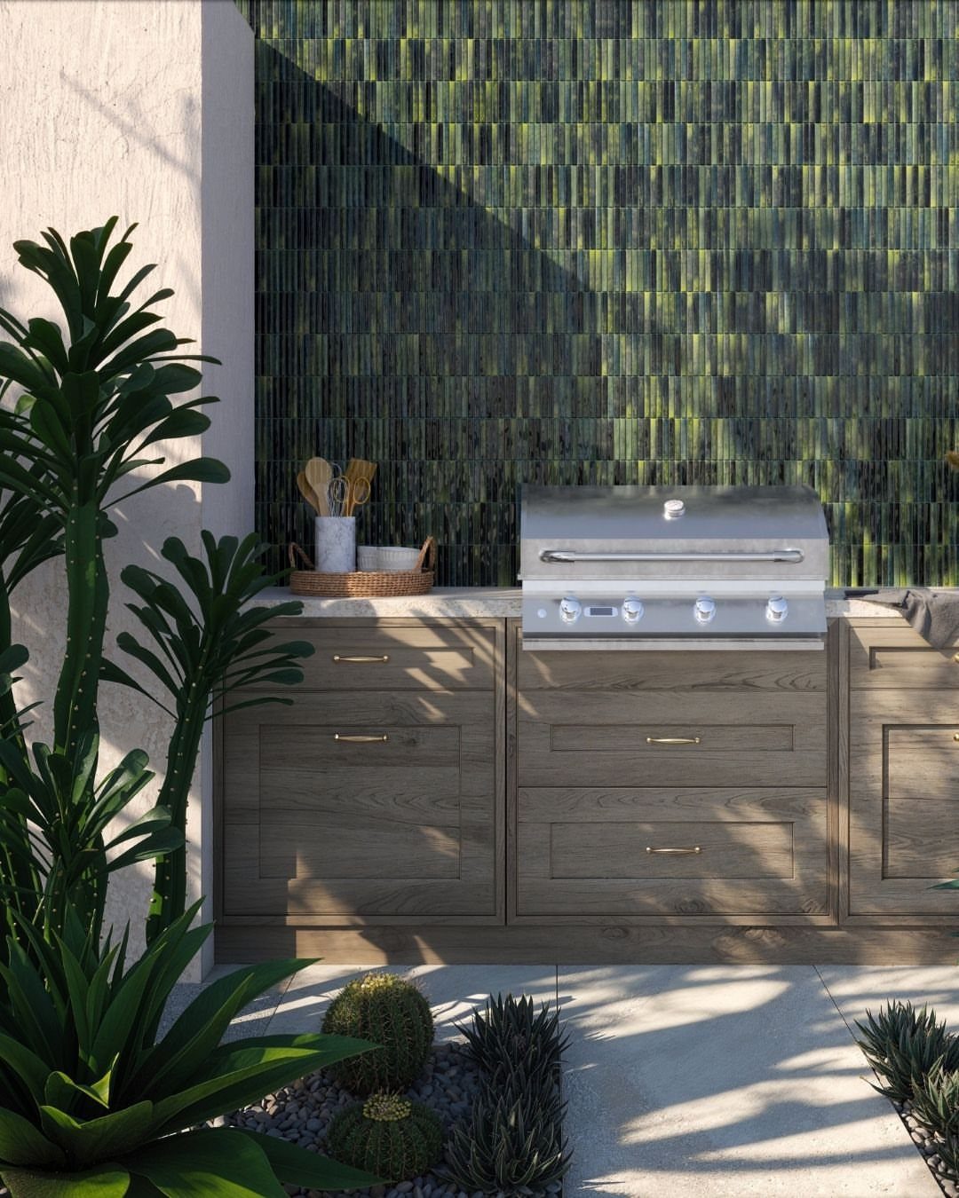 Outdoor kitchen with a stainless steel grill and green glass mosaic tile backsplash.