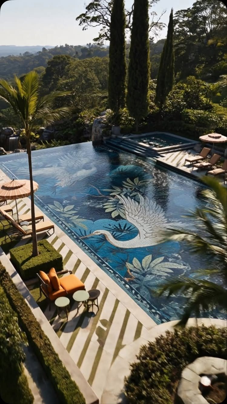 Rectangular swimming pool featuring a large swan mosaic on the blue tiled bottom.