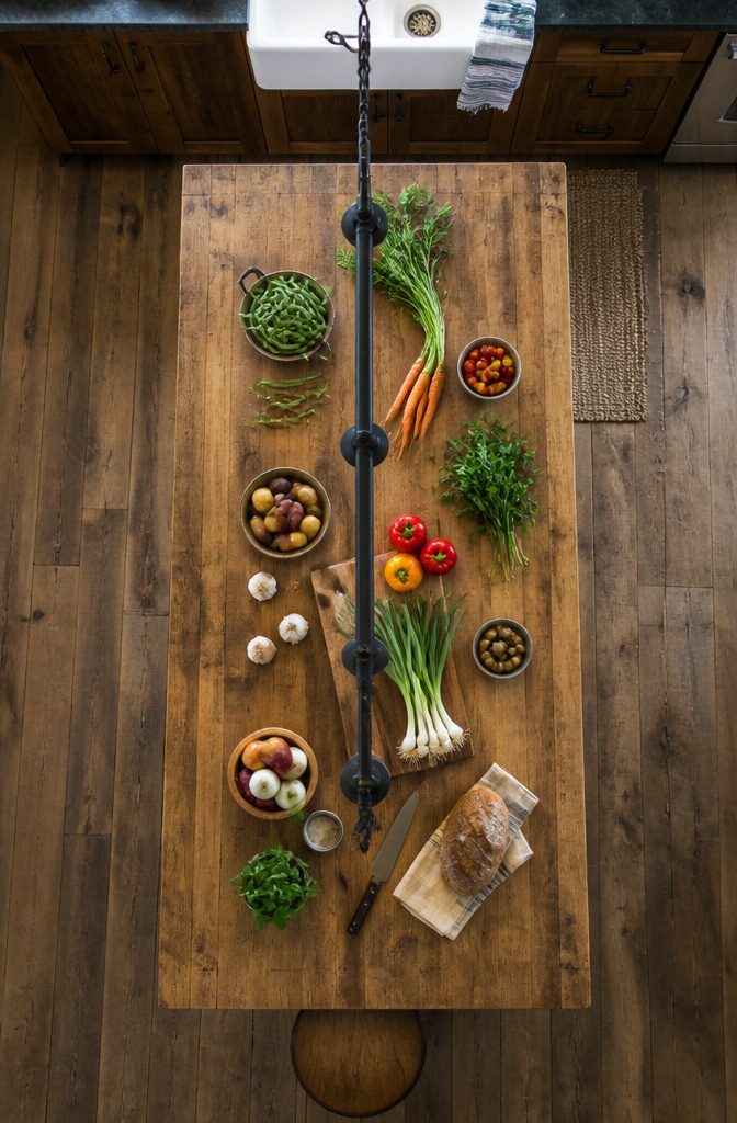 Linear pendant light fixture above a kitchen island.